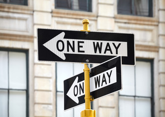 One way street signs in New York City, selective focus, USA.