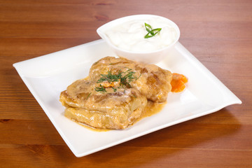 Homemade stuffed cabbage with cream