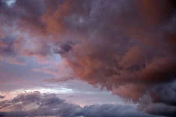Obraz na płótnie Canvas Beautiful evening sky with multi-colored bright clouds. Rain clouds at sunset