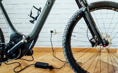 Electric bicycle with charging cable