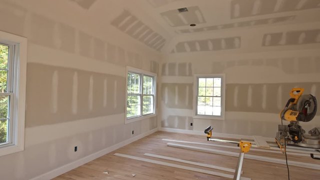 Interior construction of housing project with new home construction interior drywall and finish detailsinstalled construction materials