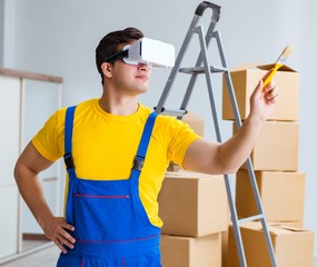 Painter contractor working with virtual reality goggles