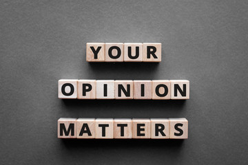 Your opinion matters - words from wooden blocks with letters, Your feedback is important concept, top view gray background