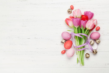 Easter greeting card with eggs and tulips