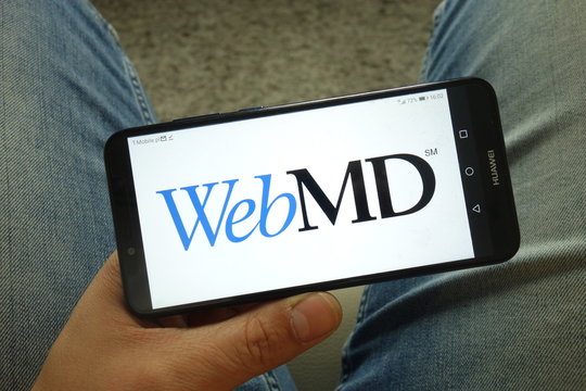 KONSKIE, POLAND - May 04, 2019: Man holding smartphone with WebMD Health Corp company logo