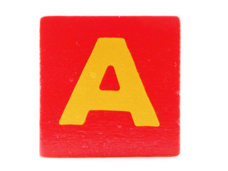 Wooden Children's Toy Alphabet Blocks On White Background.