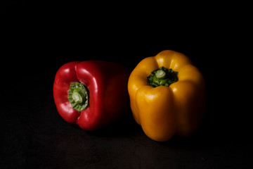 Front view of red and yellow peppers