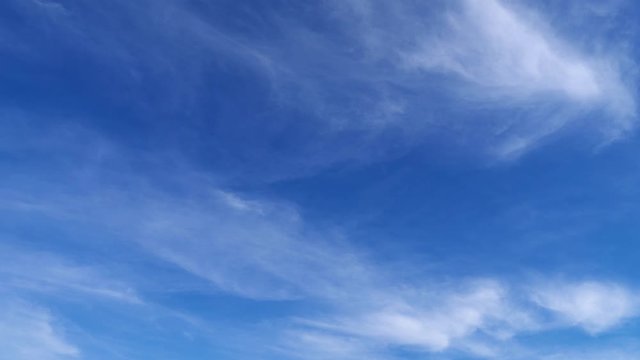 Timelapse of Bright beautiful blue sky with soft clouds for background or texture