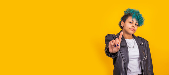 urban afro american young girl in urban fashion isolated on color background