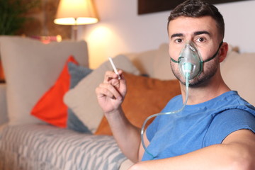 Addict using a breathing aid at home 