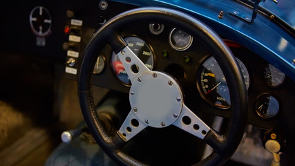 Details of interior classic car. Classic car steering wheel