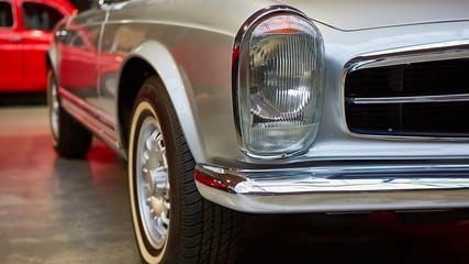Obraz na płótnie Canvas Detail of classic car. Close-up of headlight.