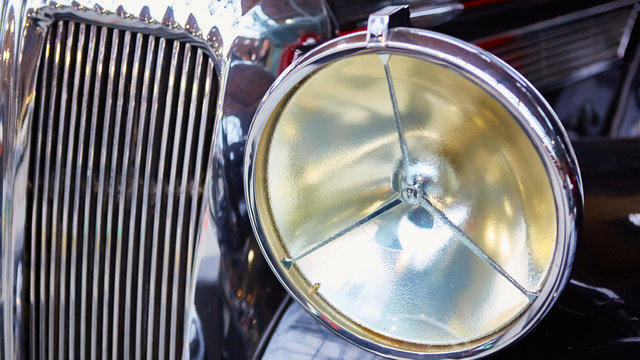 Detail of classic car. Close-up of headlight.
