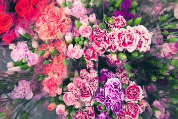 Bouquets of colorful carnations at the market close up. Beautiful floral background