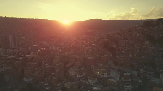 City of La Paz, Bolivia during sunset. Aerial view of the Bolivian capital during sunset (flat version of the clip, ready for color grading)