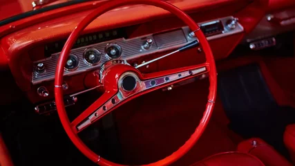 Deurstickers Details of interior classic car. Classic car steering wheel © sarymsakov.com