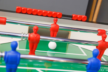 Foosball ball on table football table with figures