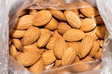 Nuts and almonds.Peeled almonds.Almonds are a genus of plants in the Rosaceae family.