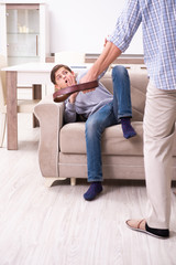 Father beating and punishing his sone