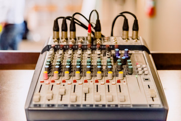 Audio mixing console in a conference room.