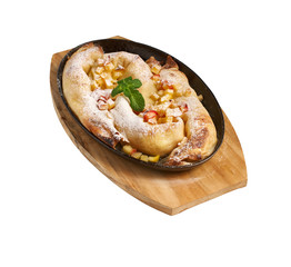 Vertuta - pastry roll with apple in a pan. Tasty and delicate pastries of Moldavian and Ukrainian cuisine. Selective focus side view on white background