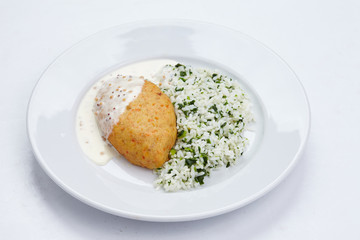 cutlet with rice and cream sauce