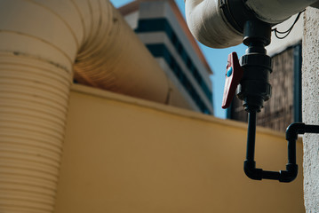 Plastic water stopcock in a drainage facility in a building.