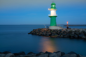 green lighthouse in the evening at baltic sea