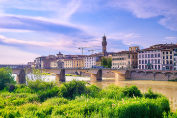 Fototapeta na wymiar A daytime view along the Arno River in Florence, Italy.