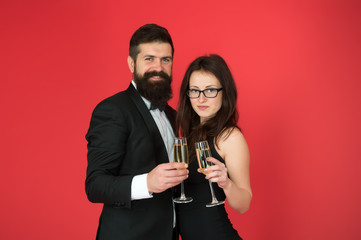 Fototapeta na wymiar Champagne is always the answer. Happy family celebrate with champagne. Couple in love enjoy champagne. Sensual woman and bearded man hold champagne glasses. Valentines day. Alcohol drink