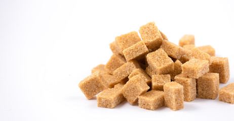 Brown sugar on a white background, healthy sugar used for cooking or desserts.