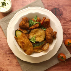 Breaded mushrooms and zucchini vegetables with herbs.