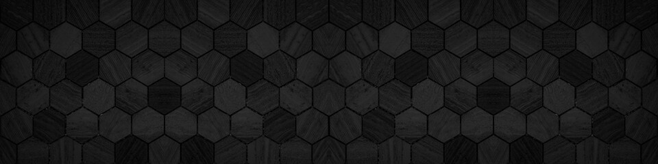 Black modern tile mirror made of hexagonal tiles texture background banner panorama