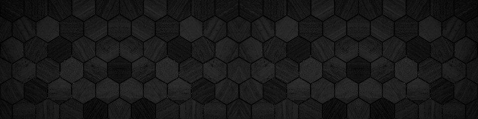 Black modern tile mirror made of hexagonal tiles texture background banner panorama