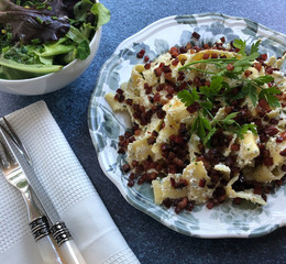 Classic Hungarian noodle specialty. Ribbon pasta with crispy bacon, curd cheese and sour cream.