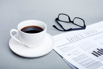 cup of coffee and newspaper	