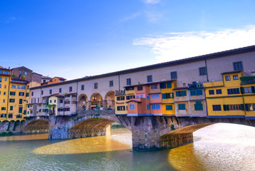 Fototapeta na wymiar A view along the Arno River towards the Ponte Vecchio in Florence, Italy.