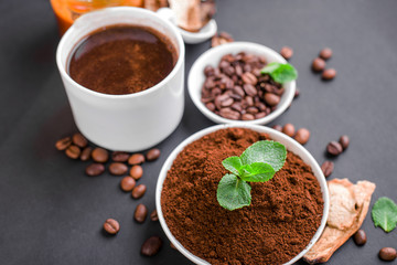 Mushroom Chaga Coffee Superfood Trend-dry and fresh mushrooms and coffee beans on dark background with mint.
