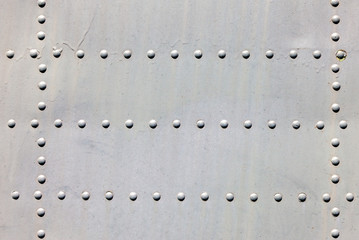 Metal surface with rivets as background