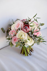 Wedding flowers, bridal bouquet closeup. Decoration made of roses, peonies and decorative plants, close-up, selective focus, nobody, objects