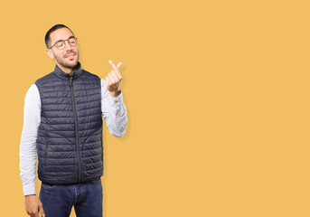 Young man making a gesture of worried about his economy