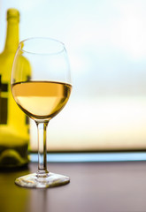 Closeup of wine glass on bar. 