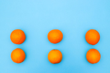 Fresh and organic healthy oranges on colored background 
