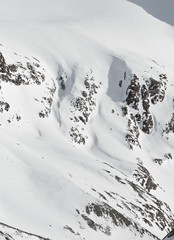 Fototapeta na wymiar Mountains in Austria in the Alps of Tyrol. Winter landscape and alpine mountain panorama in Europe. Glacier Stubaier Gletscher Skiing near Innsbruck. Beautiful rocks