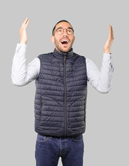 Fototapeta premium Astonished young man looking up
