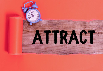 Handwriting text writing Attract. Conceptual photo to draw by a physical force causing or tending...