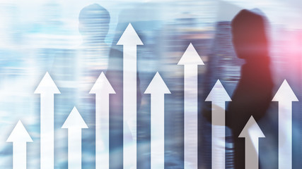 Up arrow graph on skyscraper background. Invesment and financial growth concept.
