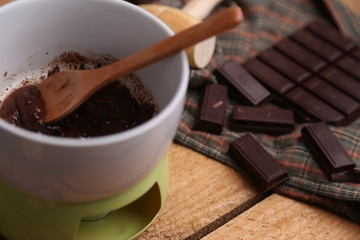 melting chocolate tablet in color background