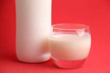 liquid yogurt bottle in color background