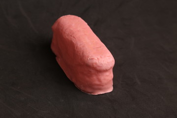 delicious pink chocolate cake in color background